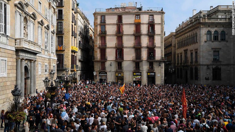 People attend a protest in Barcelona on Monday, October 2, a day after hundreds were injured in a police crackdown during Catalonia&#39;s banned independence referendum. The Catalan government claimed victory early Monday, after pushing forward with the vote despite Spain&#39;s Constitutional Court declaring it illegal.