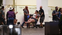A woman is moved outside the Las Vegas Tropicana resort. Multiple victims were being transported to hospitals in the aftermath of the shooting.