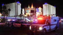 An ambulance leaves the intersection of Las Vegas Boulevard and Tropicana Avenue.
