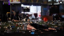 People are seen on the ground after the gunman opened fire.