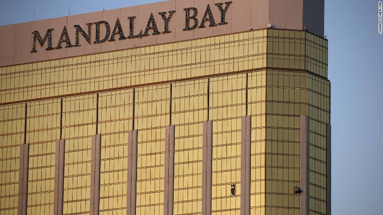 Broken windows of the Mandalay Bay are seen early in Las Vegas on Monday. Police said the gunman fired on the crowd from the 32nd floor of the hotel.