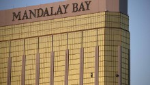 Broken windows of the Mandalay Bay are seen early in Las Vegas on Monday. Police said the gunman fired on the crowd from the 32nd floor of the hotel.
