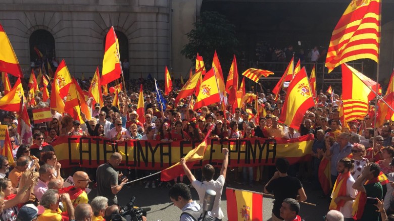 Protesters hold a banner that reads &quot;Catalonia is Spain&quot; at the pro-unity rally in Barcelona on Sunday. 