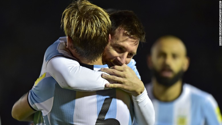 Argentina&#39;s Lionel Messi celebrates with teammate Lucas Biglia after scoring against Ecuador during their 2018 World Cup qualifier football match in Quito.