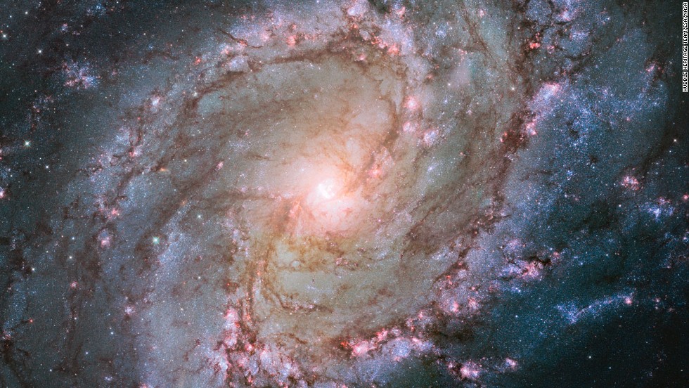 The Hubble Space Telescope captured this image of the Southern Pinwheel Galaxy, one of the largest and closest galaxies of its kind. &lt;a href=&quot;http://www.spacetelescope.org/news/heic1403/&quot; target=&quot;_blank&quot;&gt;The center of the galaxy is mysterious&lt;/a&gt;, researchers say, because it has a double nucleus -- a supermassive black hole that may be ringed by a lopsided disc of stars, giving it the appearance of a dual core.
