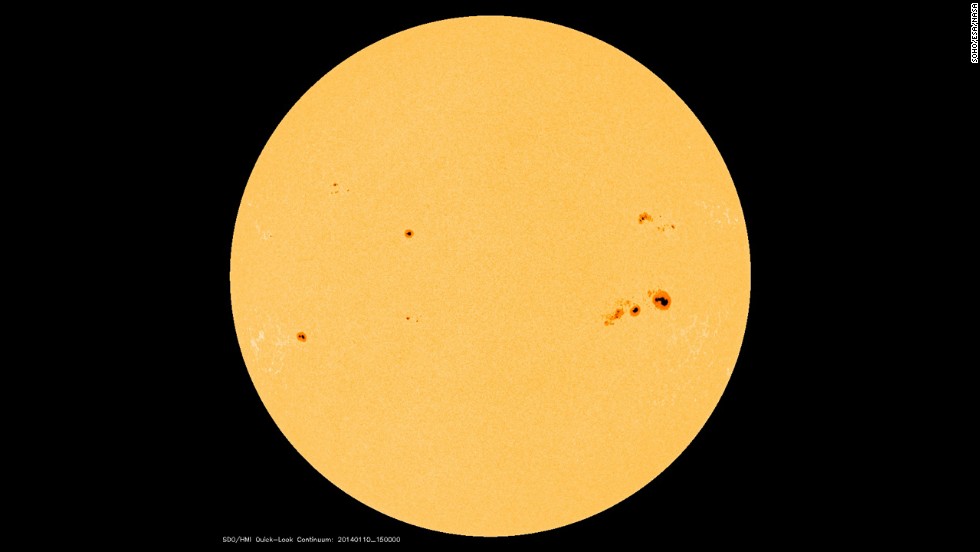 Those spots on our sun appear small, but even a &lt;a href=&quot;http://www.nasa.gov/content/goddard/giant-january-sunspots/&quot; target=&quot;_blank&quot;&gt;moderate-sized spot is about as big as Earth&lt;/a&gt;. They occur when strong magnetic fields poke through the sun&#39;s surface and let the area cool in comparison to the surrounding area.