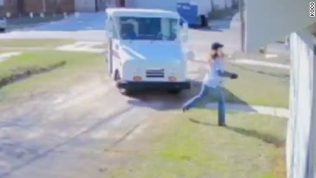 USPS worker caught on camera tossing package - CNN Video