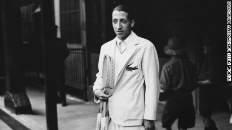 French Tennis player Rene Lacoste, one of France&#39;s &#39;Four Musketeers&#39; who won the Davis Cup in 1932, at Wimbledon. He is wearing his embroidered crocodile motif. Original Publication: People Disc - HH0434 (Photo by Topical Press Agency/Getty Images)