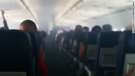 Smoke fills passenger plane - CNN Video