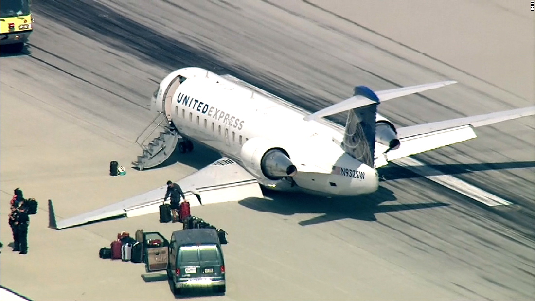 Plane makes emergency belly landing - CNN Video