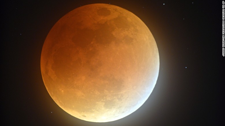 Earth&#39;s shadow partially obscures the view of a perigree full moon, or supermoon, during a lunar eclipse as seen from Stedman, North Carolina, on Sunday, September 27. The combination of a supermoon and total lunar eclipse last occurred in 1982 and will not happen again until 2033.