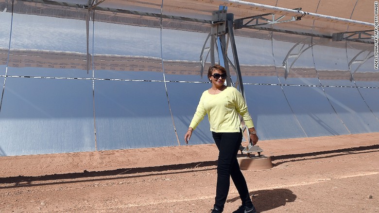Morocco&#39;s environment minister Hakima El Haite walks in front of a solar array in 2015 that is part of the Noor 1 solar power plant, which opened in February 2016. 