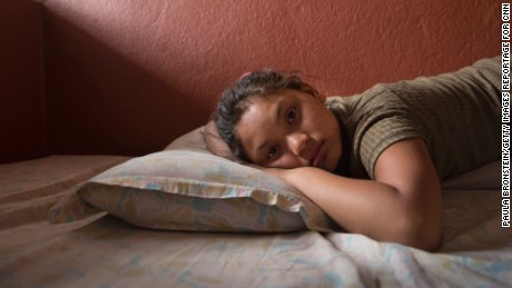 Maya Gurung, 11, poses inside her foster home in Kathmandu.