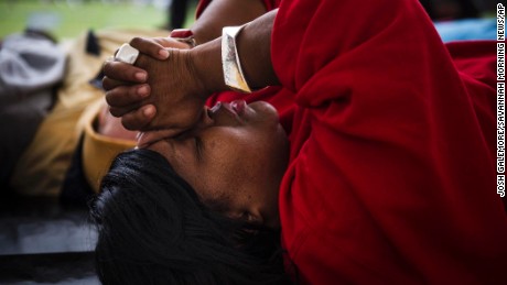 Linda Wilder Bryan who lost her son Lawrence in a shooting last August prays during the &quot;Die in, Lay in&quot; Saturday, Jan. 9, 2016, in memory of those murdered in Savannah, Ga., during 2015. (Josh Galemore/Savannah Morning News via AP) THE EXAMINER.COM OUT; SFEXAMINER.COM OUT; WASHINGTONEXAMINER.COM OUT; MANDATORY CREDIT  