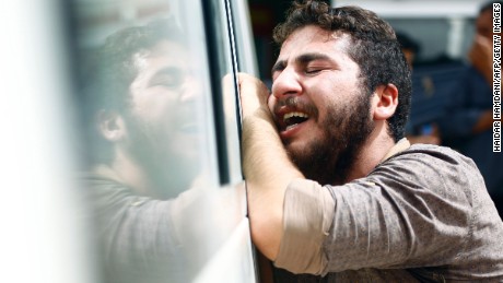 An Iraqi man mourns in the holy Iraqi city of Najaf during the funeral procession for the victims of a suicide bombing.