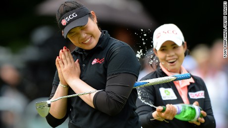 WOBURN, ENGLAND - JULY 31:  Ariya Jutanugarn of Thailand celebrates victory after holing the winning putt on the 18th green during the final round of the Ricoh Women&#39;s British Open at Woburn Golf Club on July 31, 2016 in Woburn, England.  (Photo by Tony Marshall/Getty Images)