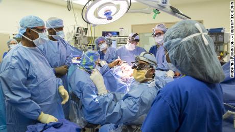 Dr. James T. Goodrich, seated center left, leads a surgical team as they prepare to separate conjoined 13-month-old twins, Jadon and Anias McDonald, at The Children&#39;s Hospital at Montefiore Medical Center in the Bronx.