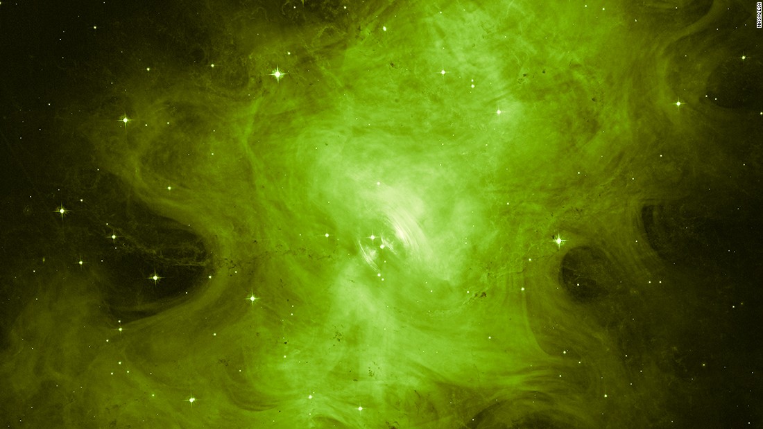 A dead star gives off a greenish glow in this Hubble Space Telescope image of the Crab Nebula, located about 6,500 light years from Earth in the constellation Taurus. NASA released the image for Halloween 2016 and played up the theme in its press release. The agency said the &quot;ghoulish-looking object still has a pulse.&quot; At the center of the Crab Nebula is the crushed core, or &quot;heart&quot; of an exploded star. The heart is spinning 30 times per second and producing a magnetic field that generates 1 trillion volts, NASA said.