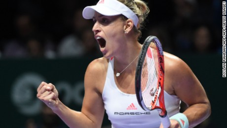 Angelique Kerber of Germany celebrates a point against Dominika Cibulkova of Slovakia during their women&#39;s singles final match at the WTA Finals tennis tournament in Singapore on October 30, 2016. / AFP / ROSLAN RAHMAN        (Photo credit should read ROSLAN RAHMAN/AFP/Getty Images)