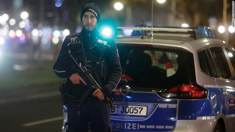 A police officer stands guard at the market  after the incident in Berlin on Monday.