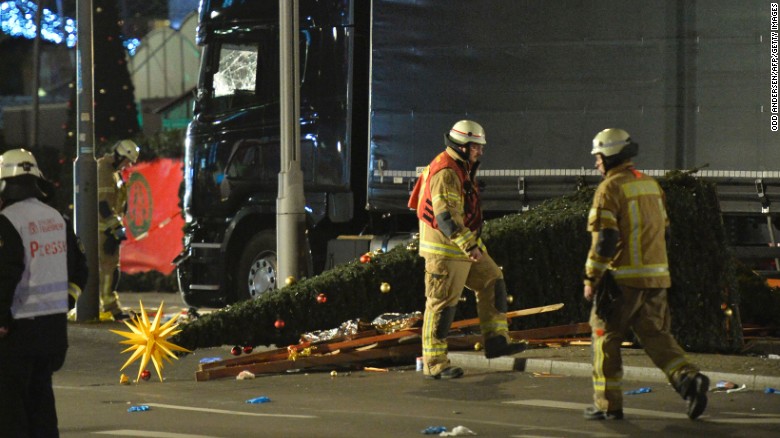 A Christmas tree lies next to a truck that crashed into a Christmas market at Gedächniskirche church in Berlin.