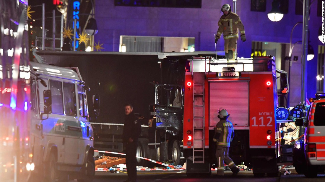 Witnesses describe moment a truck plowed through a Berlin Christmas market, killing 12 people. 