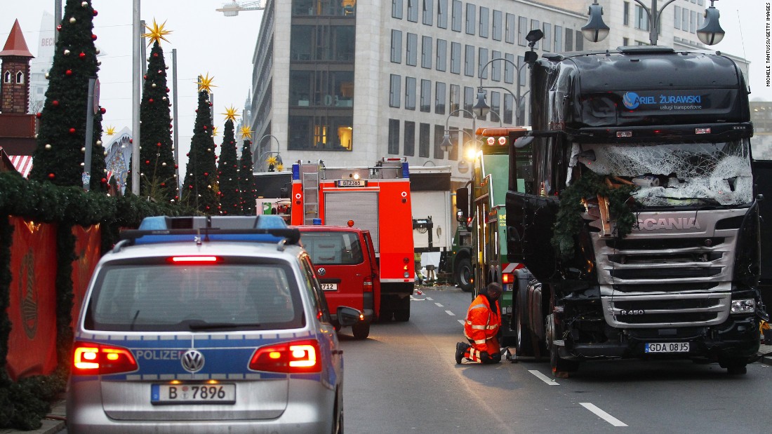 Security and rescue workers tend to the area after a lorry truck ploughed through a Christmas market  on December 20, 2016 in Berlin, Germany. So far 12 people are confirmed dead and 45 injured. Authorities have confirmed they believe the incident was an attack and have arrested a Pakistani man who they believe was the driver of the truck and who had fled immediately after the attack. Among the dead are a Polish man who was found on the passenger seat of the truck. Police are investigating the possibility that the truck, which belongs to a Polish trucking company, was stolen yesterday morning. 