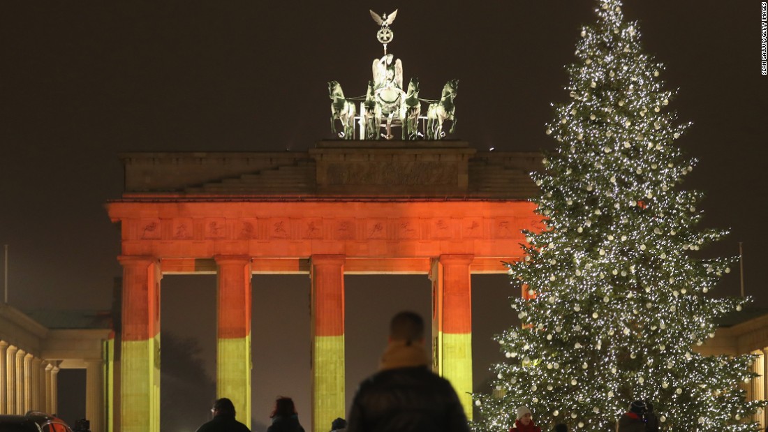 BERLIN, GERMANY - DECEMBER 20:  The Brandenburg Gate stands illuminated in the colors of the German flag the day before a truck drove into a crowded Christmas market in the city center on December 20, 2016 in Berlin, Germany. So far 12 people are confirmed dead and 45 injured. Authorities have confirmed they believe the incident was an attack and have arrested a Pakistani man who they believe was the driver of the truck and who had fled immediately after the attack. Among the dead are a Polish man who was found on the passenger seat of the truck. Police are investigating the possibility that the truck, which belongs to a Polish trucking company, was stolen yesterday morning.  (Photo by Sean Gallup/Getty Images)