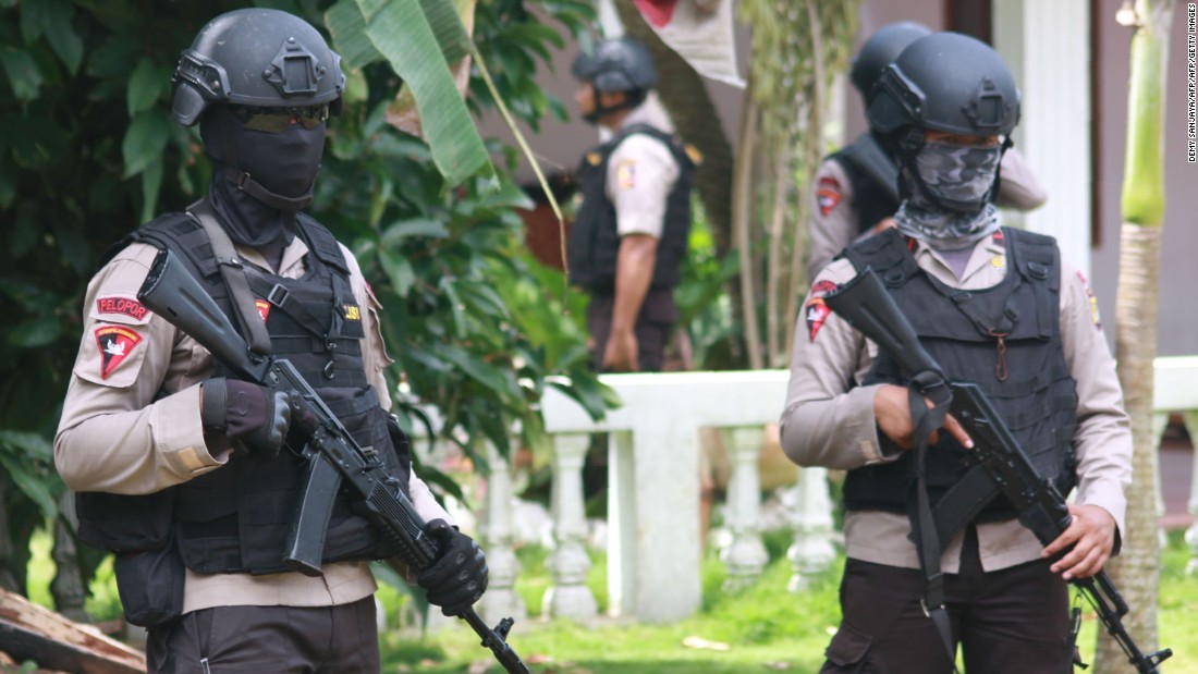 CORRECTION - Armed police secure a house after a firefight erupted as alleged militants had opened fire at officers in South Tangerang, 25 kilometres (15 miles) outside the capital Jakarta, on December 21, 2016. 
Indonesian police have foiled plans for a Christmas suicide bombing after killing three suspected militants on December 21 and discovering a cache of bombs, authorities said.
 / AFP PHOTO / Demy SANJAYA / The erroneous mention[s] appearing in the metadata of this photo by Demy SANJAYA has been modified in AFP systems in the following manner: [South Tangerang] instead of [Jakarta] for the dateline. Please immediately remove the erroneous mention[s] from all your online services and delete it (them) from your servers. If you have been authorized by AFP to distribute it (them) to third parties, please ensure that the same actions are carried out by them. Failure to promptly comply with these instructions will entail liability on your part for any continued or post notification usage. Therefore we thank you very much for all your attention and prompt action. We are sorry for the inconvenience this notification may cause and remain at your disposal for any further information you may require.DEMY SANJAYA/AFP/Getty Images