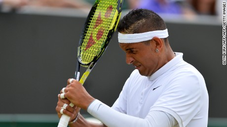 Australia&#39;s Nick Kyrgios hits himself on the head with his racket during his men&#39;s singles third round match against Canada&#39;s Milos Raonic on day five of the 2015 Wimbledon Championships at The All England Tennis Club in Wimbledon, southwest London, on July 3, 2015.   RESTRICTED TO EDITORIAL USE  --  AFP PHOTO / GLYN KIRK        (Photo credit should read GLYN KIRK/AFP/Getty Images)