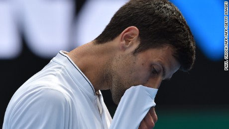 Serbia&#39;s Novak Djokovic reacts after a point against Uzbekistan&#39;s Denis Istomin during their men&#39;s singles match on day four of the Australian Open tennis tournament in Melbourne on January 19, 2017. / AFP / PAUL CROCK / IMAGE RESTRICTED TO EDITORIAL USE - STRICTLY NO COMMERCIAL USE        (Photo credit should read PAUL CROCK/AFP/Getty Images)