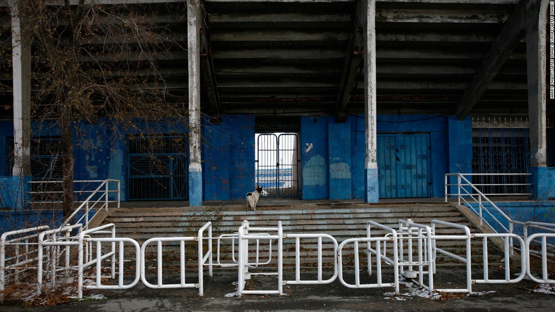 Built at the foot of the towering Mamayev Kurgan World War II memorial, the Volgograd Stadium will replace the demolished Central Stadium (pictured) and feature an open lattice exterior structure taking the form of a truncated cone. 