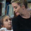 Ivanka Trump looks at her daughter Arabella as US President Donald Trump meets with parents and teachers at Saint Andrew Catholic School in Orlando, Florida, on March 3, 2017.