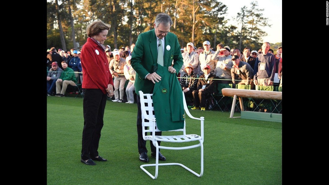 Billy Payne, the chairman of the Augusta National Golf Club, places Arnold Palmer&#39;s jacket on a chair at the honorary start of the tournament. Palmer&#39;s wife, Kathleen, looks on. Palmer, a four-time Masters winner, &lt;a href=&quot;http://www.cnn.com/2016/09/25/us/arnold-palmer-death/index.html&quot; target=&quot;_blank&quot;&gt;died in September&lt;/a&gt; at the age of 87.