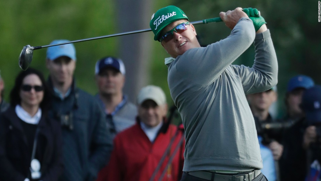 Hoffman drives the ball on the 18th hole on Thursday, April 6. He shot a 7-under 65 to take a four-shot lead after the first round.