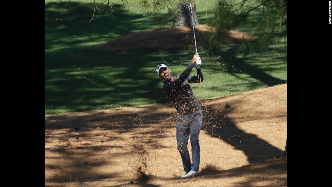 Former Masters winner Charl Schwartzel hits a shot on No. 7.