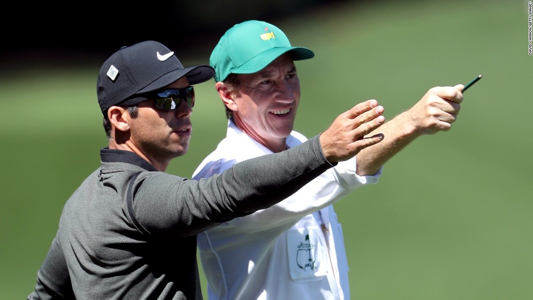 Paul Casey, left, and caddie John McLaren visualize a shot.