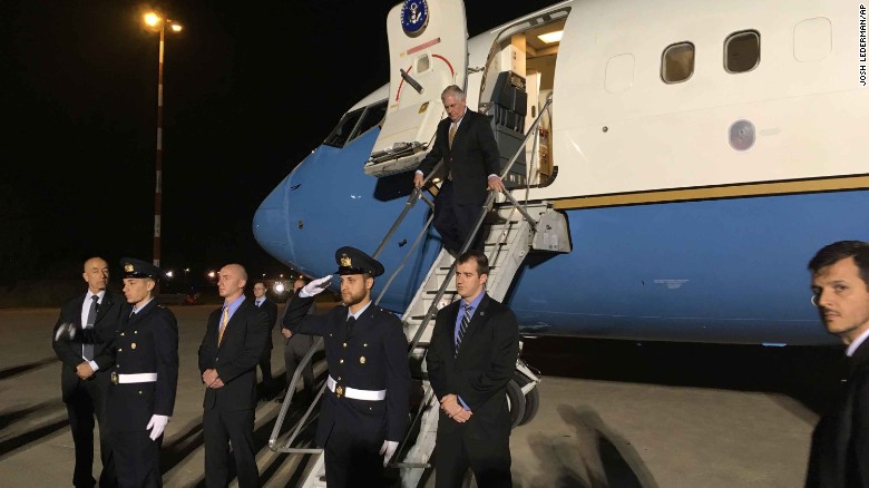 US Secretary of State Rex Tillerson steps off his plane at Pisa Military Airport on Sunday night, arriving for the G7 summit.