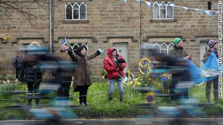 Spectators line the main street of Ripley as the riders of the Tour De Yorkshire cycle race pass through the village.