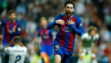 Barcelona&#39;s Argentinian forward Lionel Messi celebrates after scoring during the Spanish league Clasico football match Real Madrid CF vs FC Barcelona at the Santiago Bernabeu stadium in Madrid on April 23, 2017. / AFP PHOTO / OSCAR DEL POZO        (Photo credit should read OSCAR DEL POZO/AFP/Getty Images)