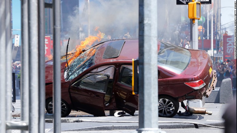 A wrecked vehicle is on fire after hitting pedestrians in New York's Times Square on Thursday, May 18. The incident is being investigated as an accident, a New York police official said. The driver is in custody.