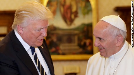 ALTERNATIVE CROP VERSION - Pope Francis (R) exchanges gifts with US President Donald Trump during a private audience at the Vatican on May 24, 2017. US President Donald Trump met Pope Francis at the Vatican today in a keenly-anticipated first face-to-face encounter between two world leaders who have clashed repeatedly on several issues. / AFP PHOTO / POOL / Alessandra Tarantino        (Photo credit should read ALESSANDRA TARANTINO/AFP/Getty Images)