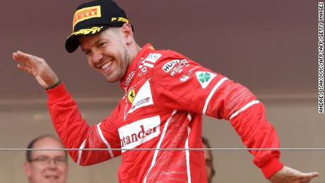 Sebastian Vettel celebrates on the podium after winning the 2017 Monaco Formula 1 Grand Prix.