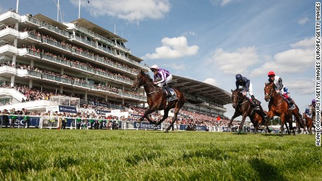 EPSOM, ENGLAND - JUNE 03:  Padraig Beggy riding Wings Of Eagles (L, pink cap) win The Investec Derby from Cliffs Of Moher (C, dark blue) on Investec Derby Day at Epsom Racecourse on June 3, 2017 in Epsom, England. (Photo by Alan Crowhurst/Getty Images)