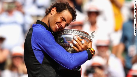 Rafael Nadal of Spain celebrates victory with the trophy following the mens singles final against Stan Wawrinka of Switzerland on day fifteen of the 2017 French Open at Roland Garros on June 11, 2017 in Paris, France.  