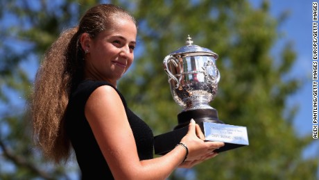 PARIS, FRANCE - JUNE 11:  Jelena Ostapenko of Latvia, winner of the ladies singles final poses with the Suzanne Lenglen Trophy outside the Suzanne Lenglen statue on day fifteen of the 2017 French Open at Roland Garros on June 11, 2017 in Paris, France.  (Photo by Alex Pantling/Getty Images)