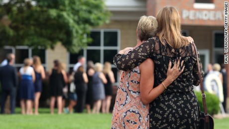 Mourners gather outside Wyoming High School on Thursday, before the funeral for Otto Warmbier. 