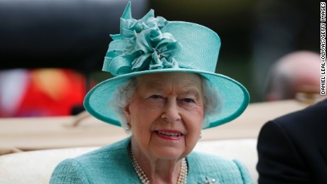 Britain&#39;s Queen Elizabeth II  arrives by carriage on the fourth day of the Royal Ascot horse racing meet, in Ascot, west of London, on June 23.
