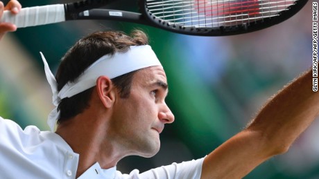 Switzerland&#39;s Roger Federer serves against Ukraine&#39;s Alexandr Dolgopolov during their men&#39;s singles first round match on the second day of the 2017 Wimbledon Championships