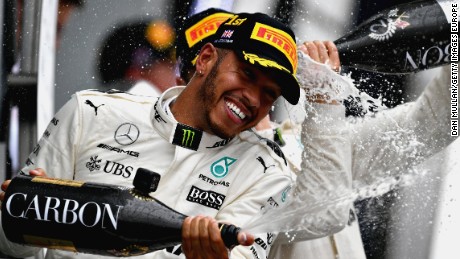 Lewis Hamilton celebrates in traditional style after winning his fourth race of the 2017 season.